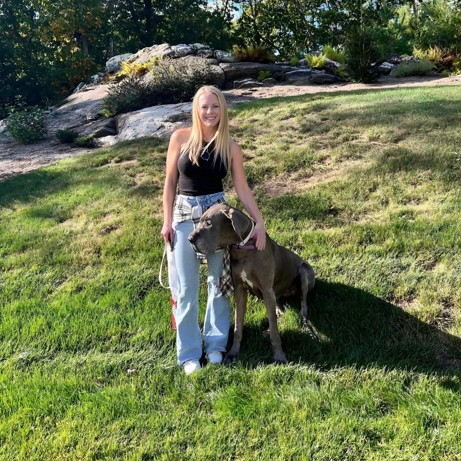 OWNER OF DANE GOOD., KELLY HOLLAND, STANDING WITH HER GREAT DANE, LADY